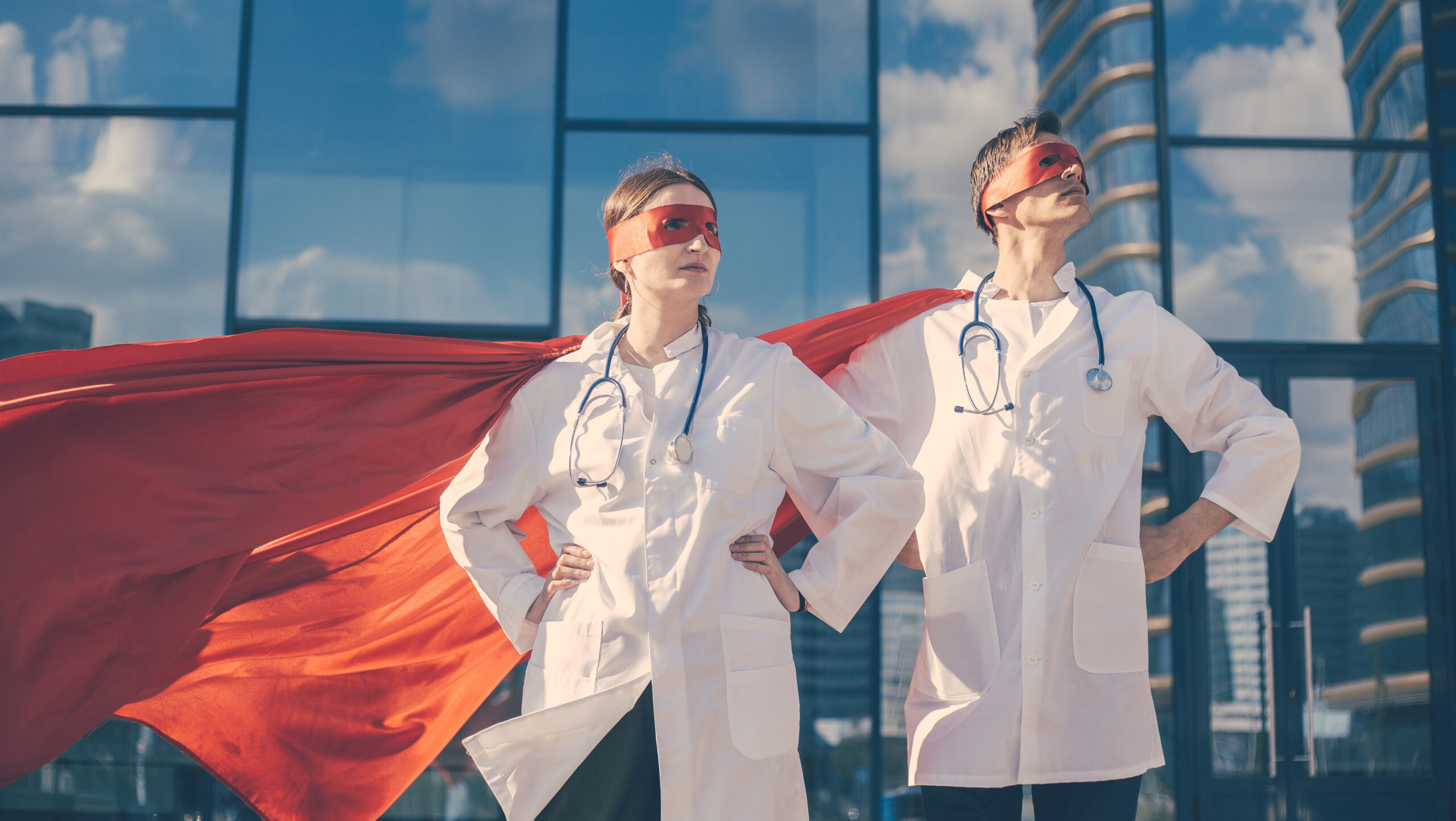 Close up doctors are superheroes standing on a city street