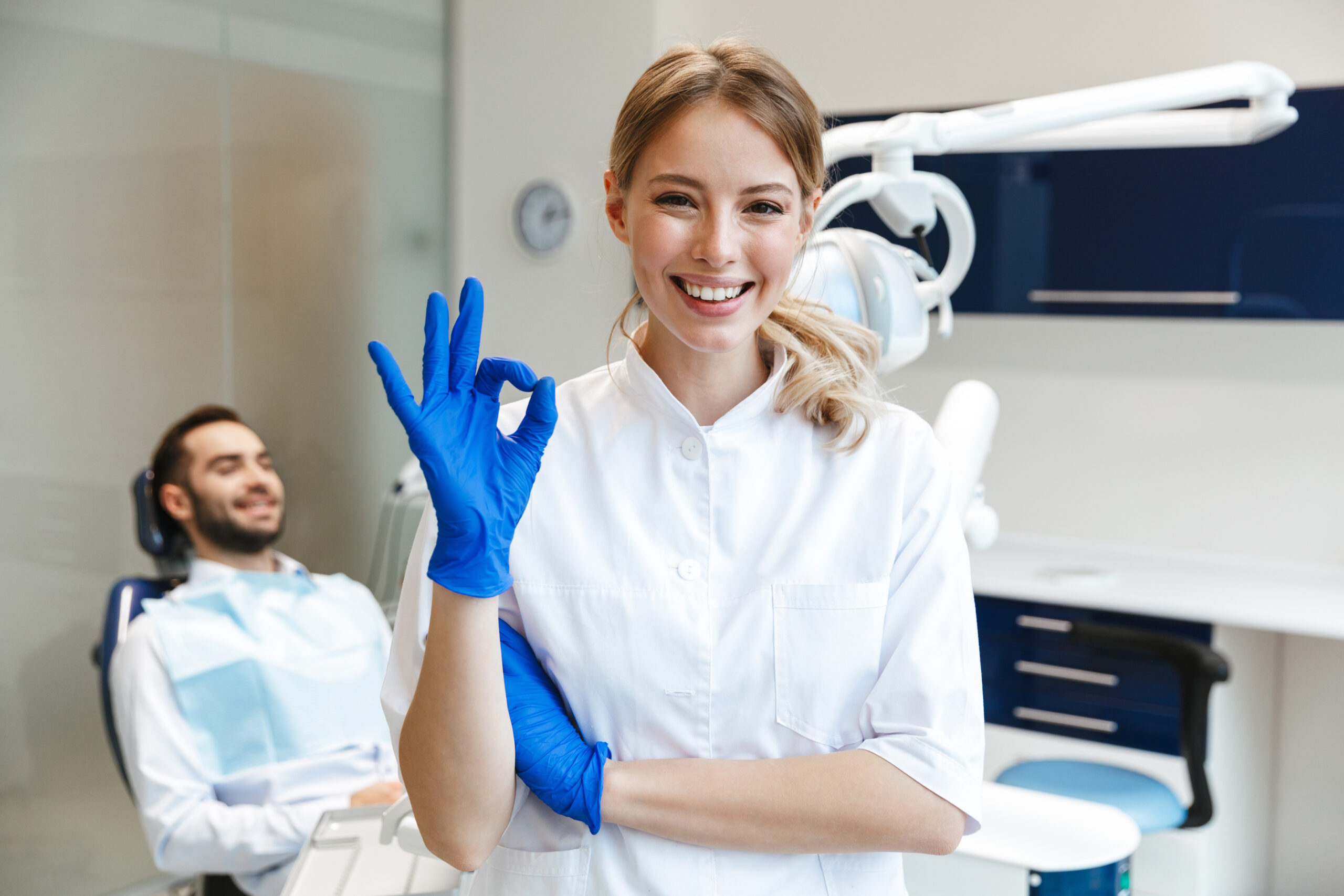 Happy young woman doctor in medical dentist center